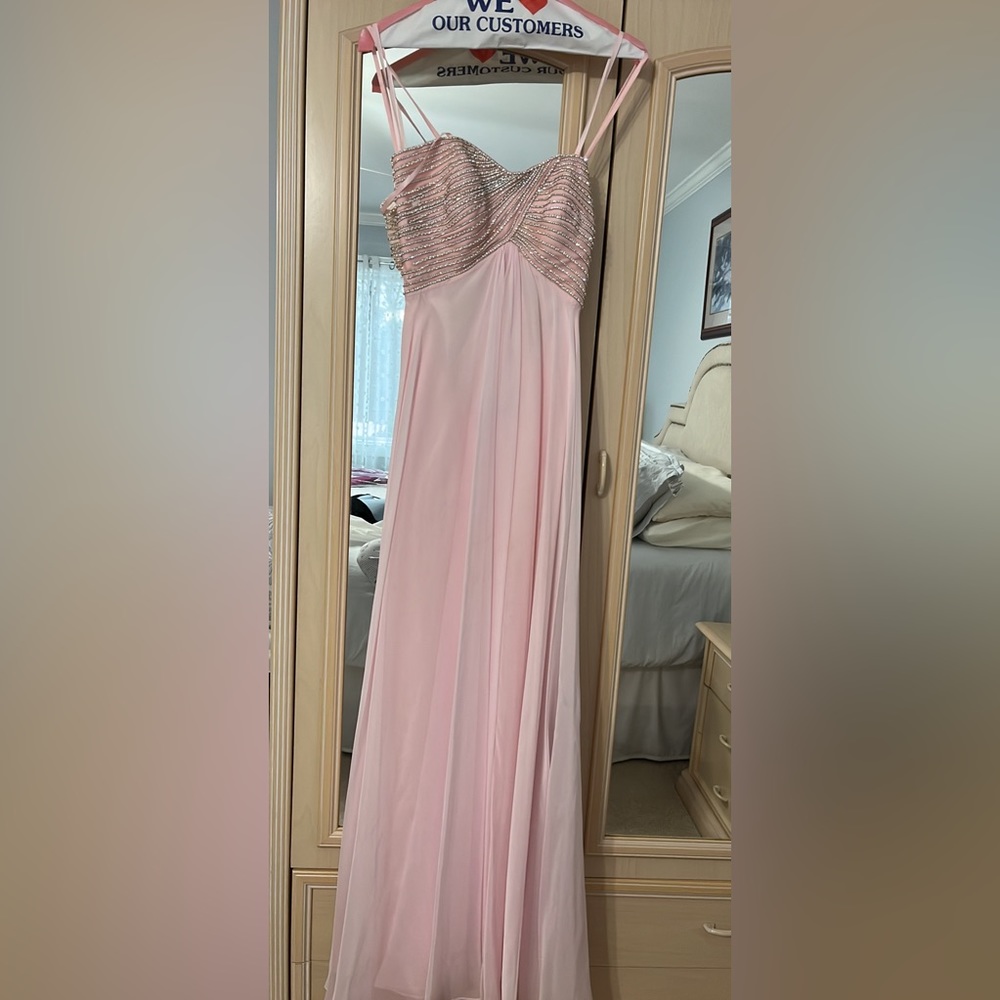 Light pink strapless gown with beading on the bust, open back
